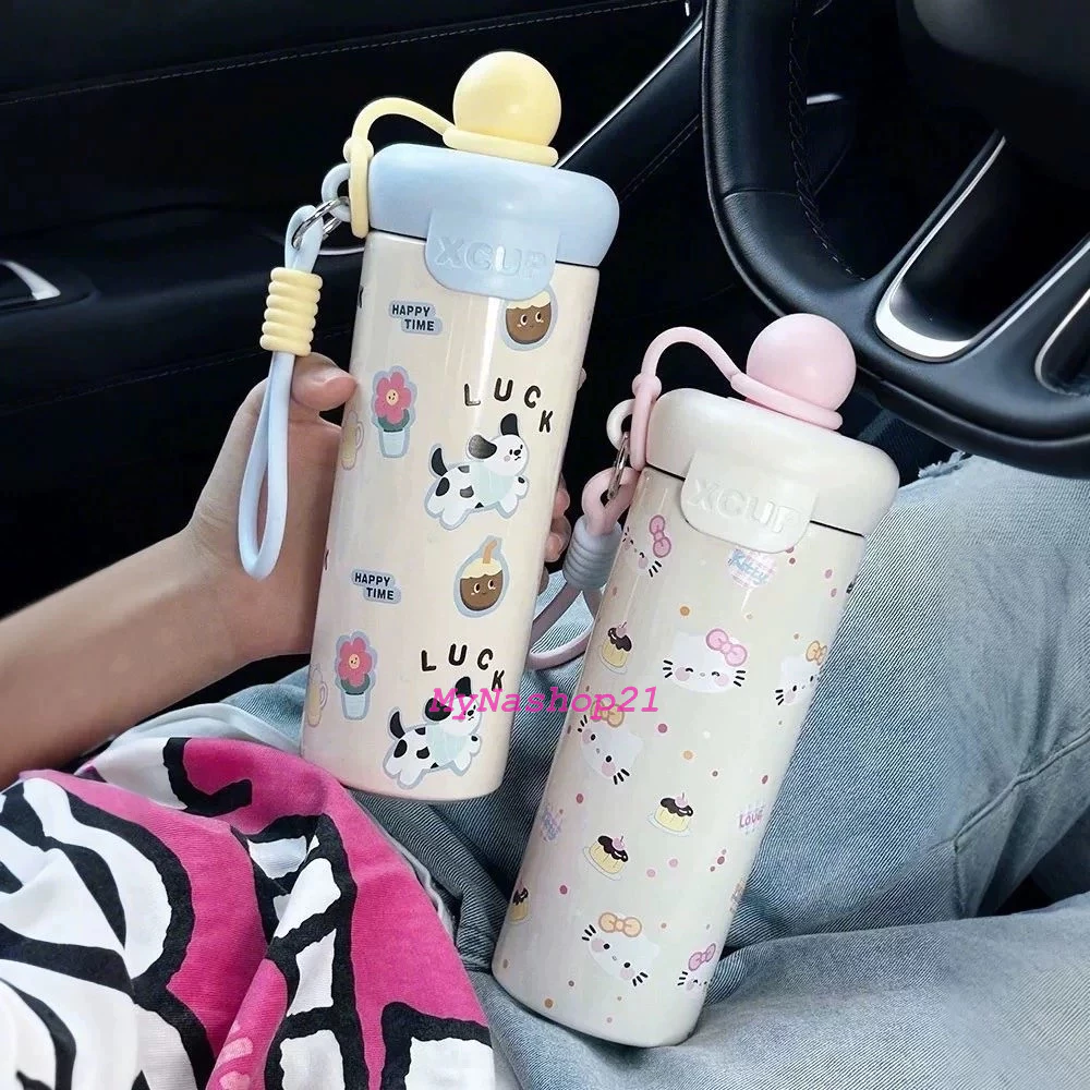 Bình giữ nhiệt 600ml nắp chống tràn, thiết kế tiện lợi với quai xách cho học sinh và dân văn phòng 2025.